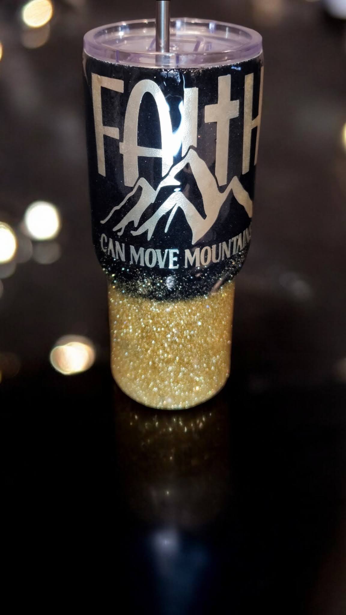 Faith Can Move Mountains 25 oz black and gold tumbler with lid and metal straw